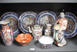 Four 19th/20th Century Chinese polychrome plates, each depicting geishas within a blue border,