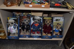 A collection of five 'Compare the Meerkat' stuffed toys, in boxes.