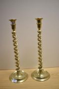 A pair of 19th/20th Century brass twist stem candlesticks, measuring 43cm