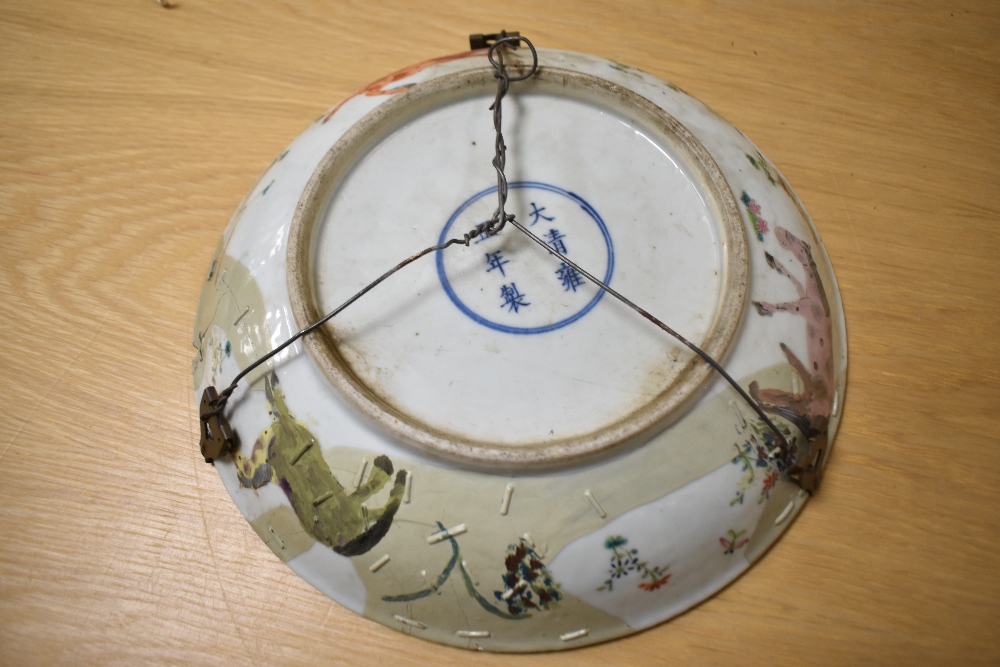 A late 19th/early 20th Century Chinese Famille Rose charger, decorated with a depiction of the 8 - Image 3 of 3