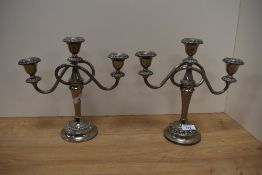 A pair of silver plated candlesticks.