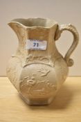 A Victorian Masons Ironstone salt glazed jug, with relief moulded decoration depicting exotic