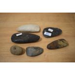 A collection of natural stone axe heads, of Papua New Guinea interest.