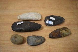 A collection of natural stone axe heads, of Papua New Guinea interest.