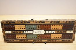 A Victorian Masonic cribbage board, marquetry inlaid and with bone panels, measuring 32cm long