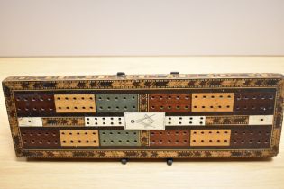 A Victorian Masonic cribbage board, marquetry inlaid and with bone panels, measuring 32cm long