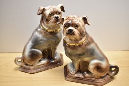 A pair of Staffordshire late 19th Century style Scottish Bo'ness pottery pugs, having glass eyes,