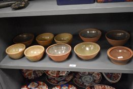 An assorted collection of mid-20th Century studio pottery, to include Coxwold Pottery bowls, the