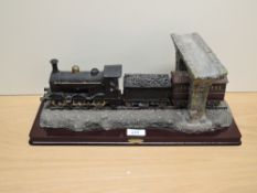 A modern Comego The Juliana Collection resin model, 0-6-0 Steam Train with tender and carriage going