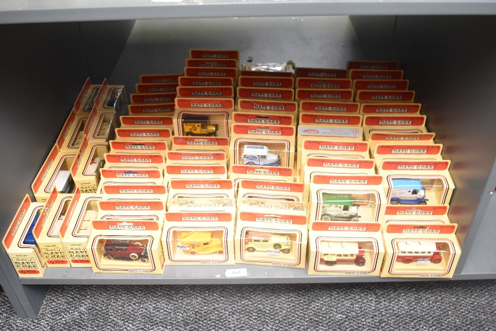 A shelf of Lledo Days Gone die-casts, Vintage Cars and Trucks, 90+, all in window display boxes