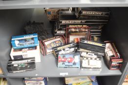 A shelf of 1970's and 1980's Scaletrix Cars and Track, March Ford 721, Airfix MRRC Performance