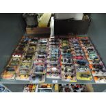 A shelf of modern Matchbox die-casts, 2011 period, 70 in total, all on bubble display cards, all