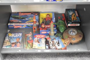 A shelf of Thunderbird, Captain Scarlet and Strigray Collectables including JR21 Toy Thunderbird 4