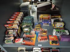 A shelf of mainly modern Corgi die-casts including 490 Mettoy Company Touring Cravan, 1980's Cars of