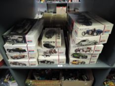 Twelve Monogram 1:24 scale Vintage Car plastic Model Kits, all opened, some part made, not checked