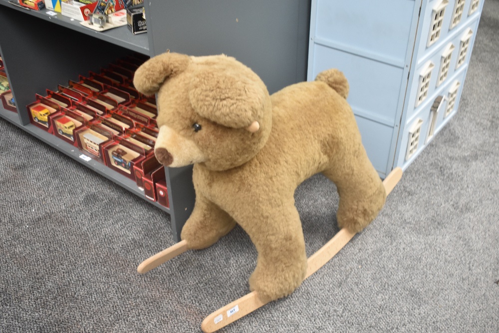 A modern plush Rocking Teddy Bear on traditional rocker base, length 85cm, height 70cm