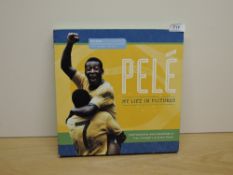A volume, Pele My Life In Pictures by Simon & Schuster, in original slip case