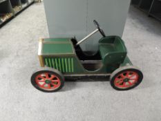 A modern wooden Strega Rocking Car, vintage model car with adjustable wheel for access to seat, turn