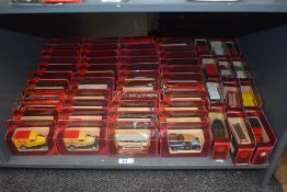 A shelf of Matchbox Models of Yesteryear die-casts, Vintage Trucks and Buses, 56 in total, all in