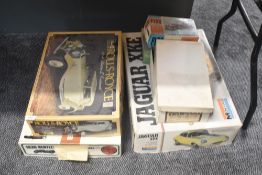 A collection of part made plastic kits and empty kit boxes, Monogram, Airfix, Revell Pyro etc