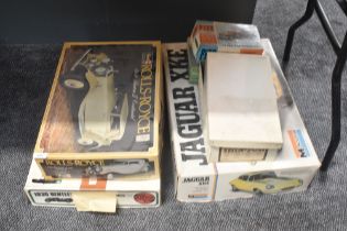A collection of part made plastic kits and empty kit boxes, Monogram, Airfix, Revell Pyro etc