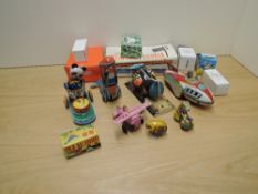 A collection of mixed vintage Tin Plate Toys including Rocket Racer, Training Plane, Woodpecker,
