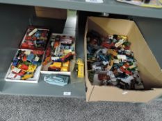 A shelf of playworn die-casts mainly Matchbox in four various sized boxes