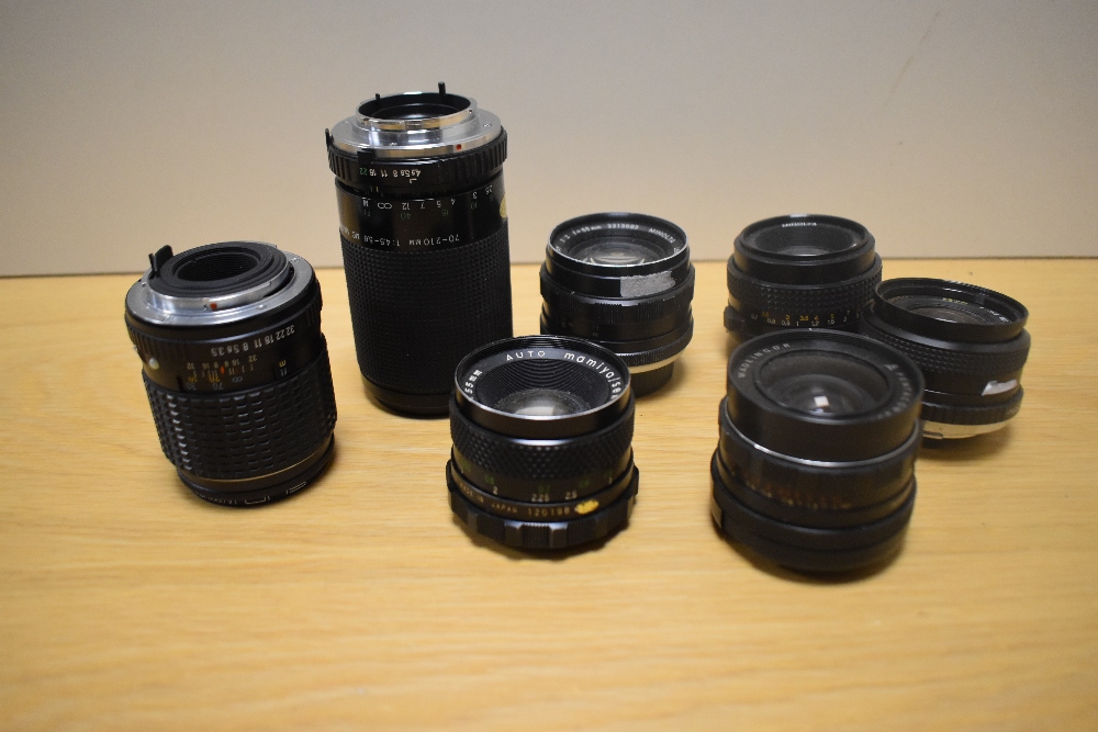 Seven Various lenses. An Exakta MC Macra 1:4,5-5,6 70-210mm, A Mamiya Sekor SX !:1,8 55mm, a Minolta