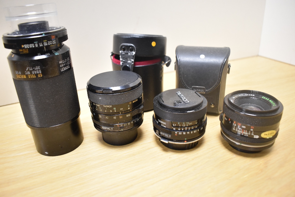 Four Tamron lenses. A 1:2,5 28mm, a 1:2,8 28mm, a CF Macro 1:3,5-4,5 28-50mm and a CF Tele Macro 1: