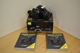 A Nikon D5300 camera boxed with booklet
