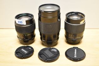 Three Chinon lenses. A MC 1:2,8 135mm, an Auto 1:2,8 135mm and an Auto MC 1:3,5 200mm