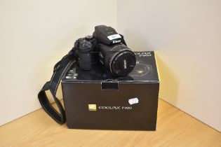 A Nikon Coolpix P900 camera in original box (no charger)