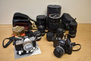 Two Nikkormat cameras and lenses. A Nikkormat FT2 body, a Nikkormat EL camera with Nikkor 1:2,8 28mm