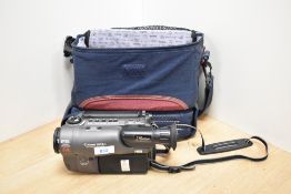 A Canon UC9Hi 8mm video camera with optical zoom, cables, charger and soft carry bag