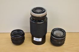 Three Vivitar lenses. A wide angle 1:2,8 28mm, a wide angle 1:2,8 35mm lens and a Macro Focusing