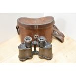 A pair of Ross of London Stereo Prism binoculars Power 6 having military crowsfoot mark in a leather