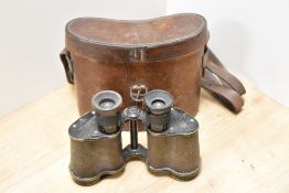 A pair of Ross of London Stereo Prism binoculars Power 6 having military crowsfoot mark in a leather