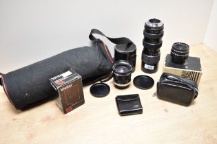 Three lenses. A Meyer Optic Gorlitz 3,5 30mm lens, a Soligar Macro Zoom 1:3,8 85-205mm lens and a