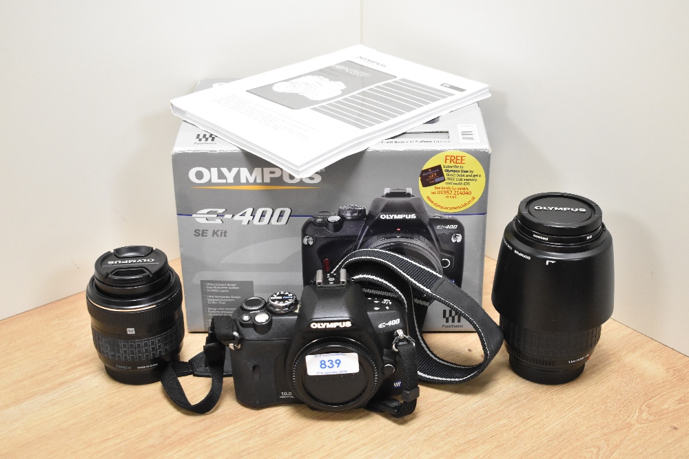 A boxed Olympus E400 camera body with Zuika Digital 17.5-45mm 1:3,5-5,6 lens, and Zuika Digital 40-
