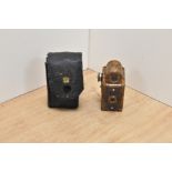 A Coronet Midget miniature camera in brown bakelite by Coronet Camera Company, Birmingham in
