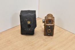 A Coronet Midget miniature camera in brown bakelite by Coronet Camera Company, Birmingham in