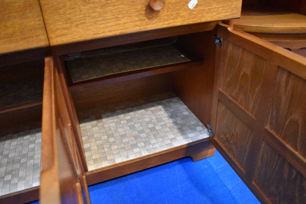 A vintage teak sideboard/dresser by Nathan, having cocktail and display section over triple frieze - Image 4 of 4