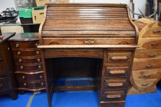 An early 20th Century oak roll top desk of small proportions, width approx 92cm, height 112cm