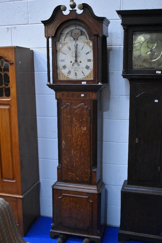 A 19th Century oak longcase clock having mahogany cross banding, with 8 day movement and painted