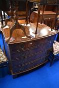 A reproduction Regency style mahogany bow fronted chest of four long drawers