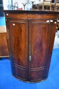 A 19th Century mahogany bow front corner cupboard , height approx. 117cm