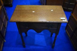 A period style golden oak side table of nice proportions having frieze drawers, shaped apron and