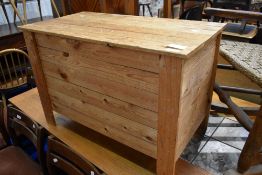 A natural pine blanket or toy box, approx dimensions 79 x 42 x 52cn
