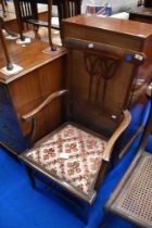 An Edwardian mahogany carver chair