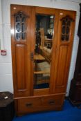A Victorian wardobe, missing top cornice, fretwork to glass panels, height approx 184cm